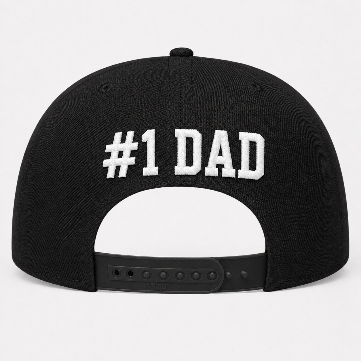 Black cap with '#1 DAD' text on a light gray background