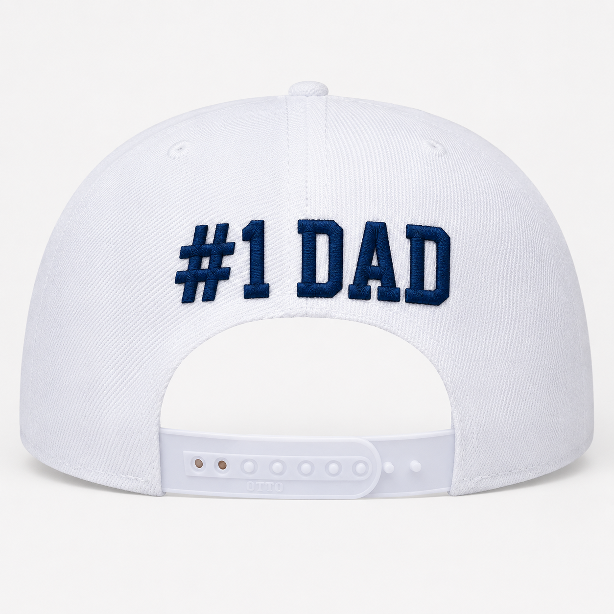 White cap with '#1 DAD' text on a white background