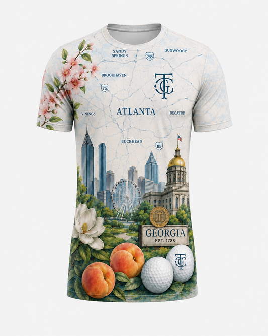 ATL Metro Map All-Over Standard Fit Tee front view with Atlanta skyline, peach, magnolia, golf ball, and map artwork.