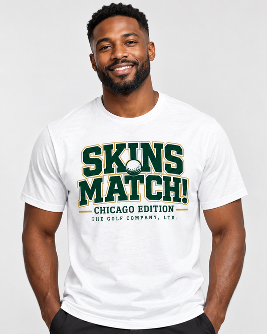 Front view of an African-American male model wearing the SKINS MATCH! — Chicago Edition Tee, highlighting the green-and-gold front graphic and premium white cotton construction.