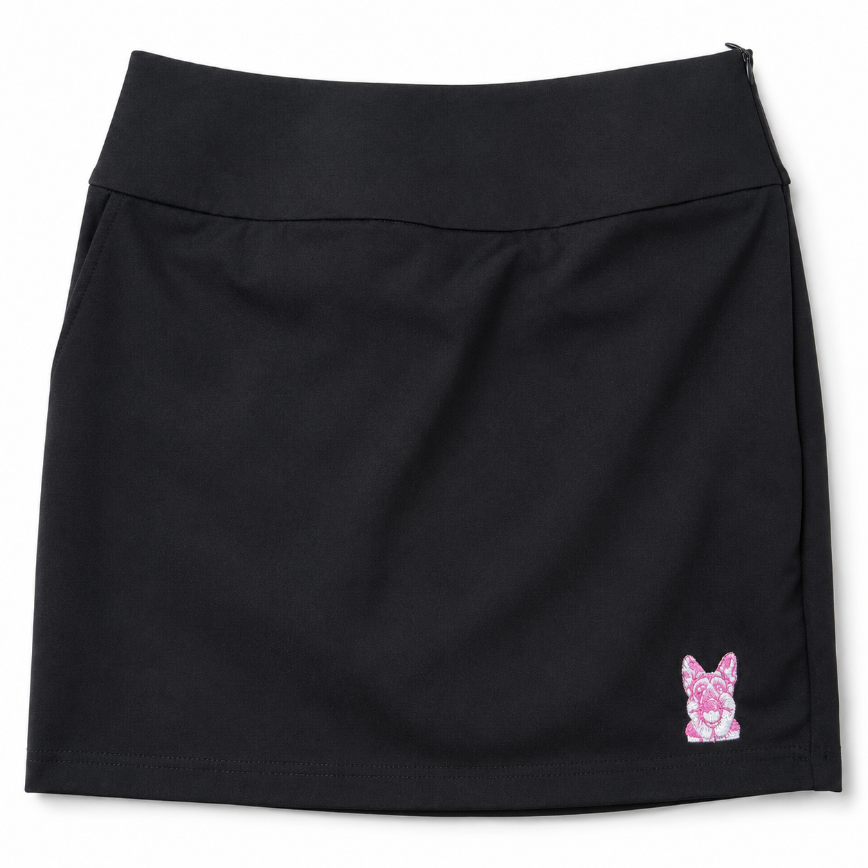 Women’s black performance golf skort front view with pink embroidered dog logo by The Golf Company Ltd.