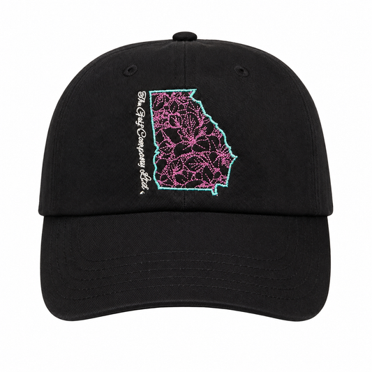 Black cap with pink and blue lace design and text on a white background