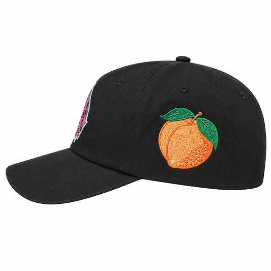Black cap with embroidered peach design on a white background