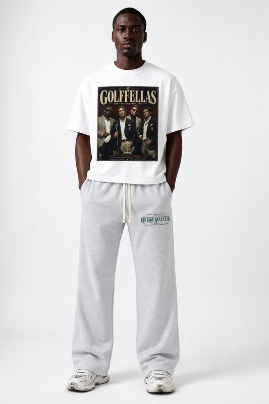 Male model wearing Vintage White Golffellas Vintage Tee with grey Vintage Golf Club sweatpants