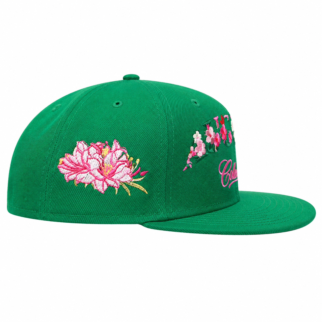 Green cap with pink floral embroidery on a white background
