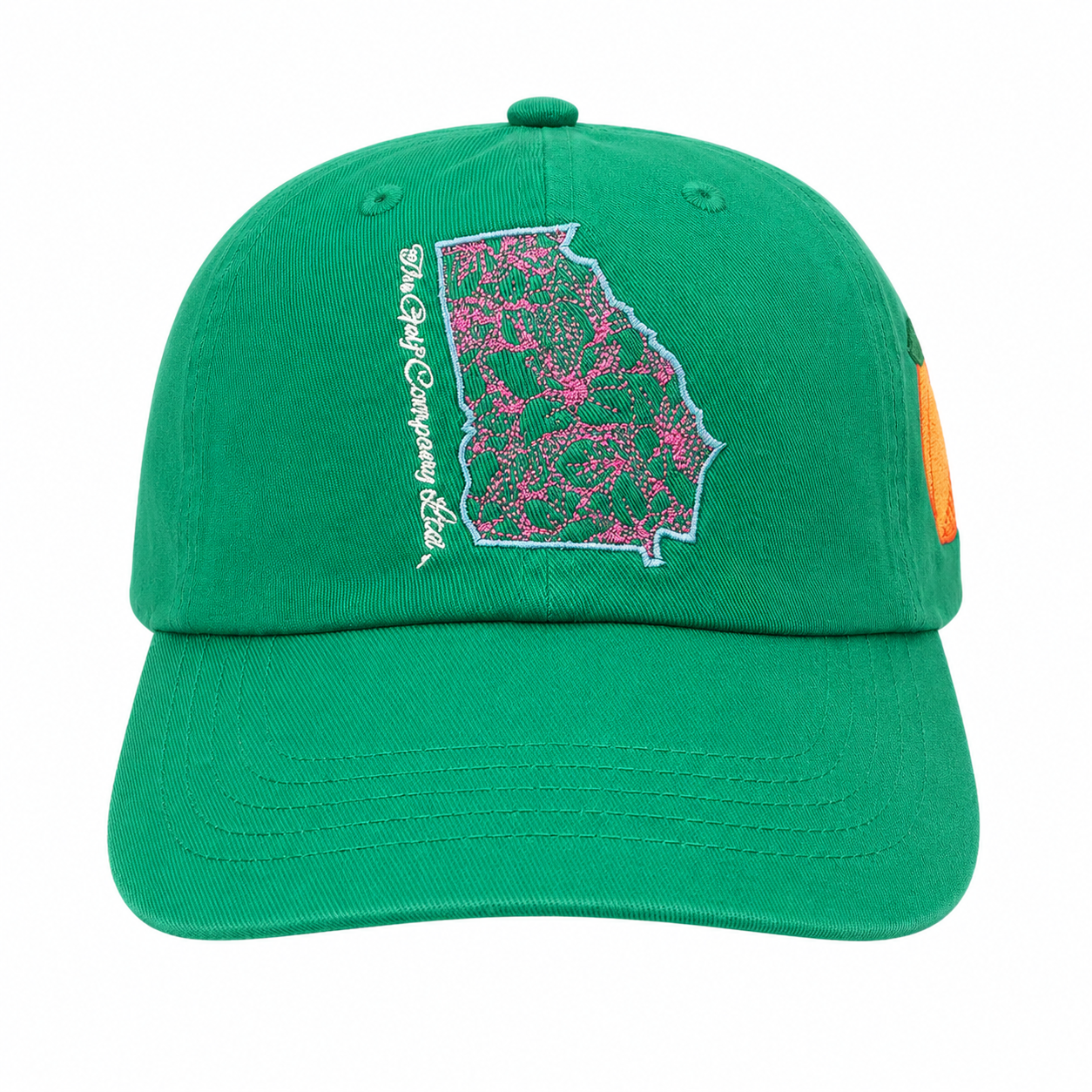 Green cap with a pink and green patterned design on a white background