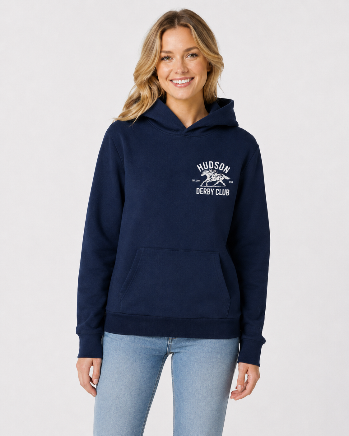 Woman wearing a navy hoodie with a logo on a white background
