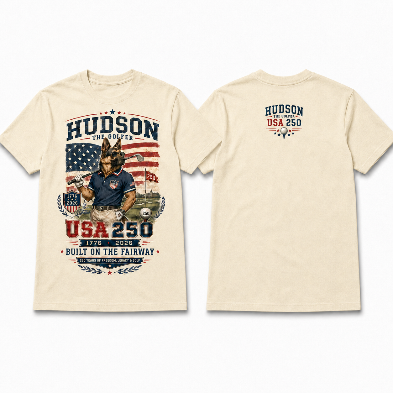 Cream Hudson the Golfer USA 250 cotton tee with patriotic American flag golf artwork, Hudson holding a golf club, 1776–2026 detail, and Built on the Fairway text.