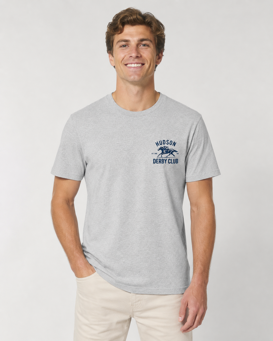 Man wearing a gray t-shirt with a logo on a white background