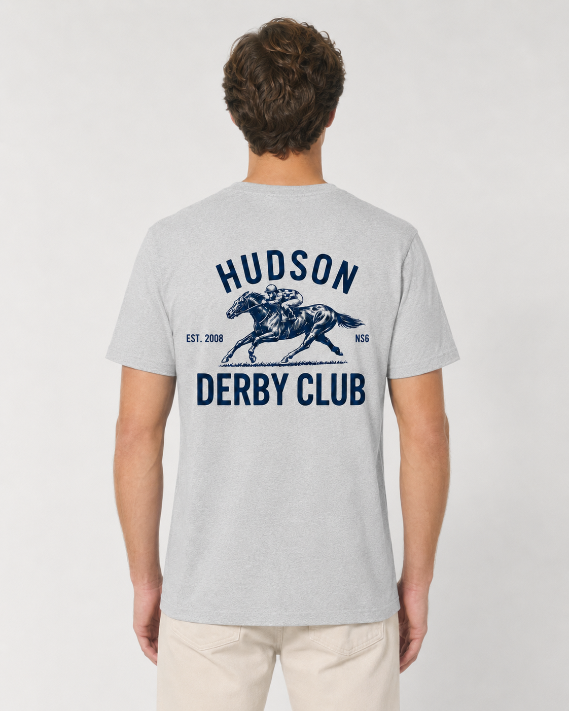 Person wearing a gray t-shirt with 'Hudson Derby Club' design on the back.