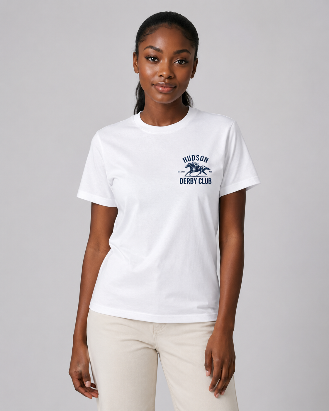 Person wearing a white t-shirt with a logo and text on a gray background