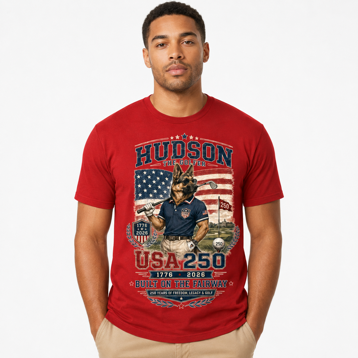 Red Hudson the Golfer USA 250 cotton tee with patriotic American flag golf artwork, Hudson holding a golf club, 1776–2026 detail, and Built on the Fairway text.