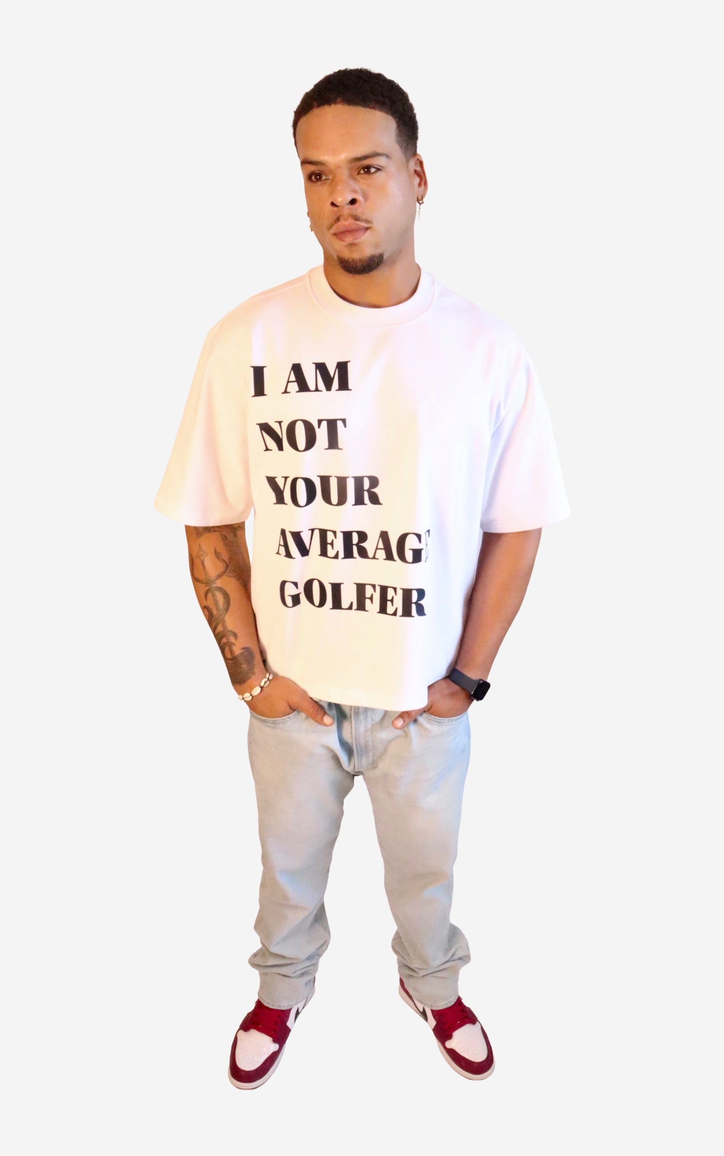 Model wearing a t-shirt with text 'I AM NOT YOUR AVERAGE GOLFER' on a white background