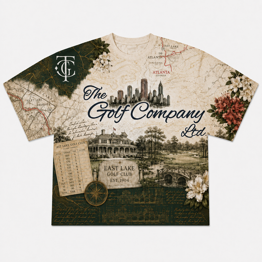 A short-sleeve crewneck t-shirt featuring a vintage-style collage print with maps, golf course imagery, script text, and floral accents. The text 'The Golf Company Ltd.