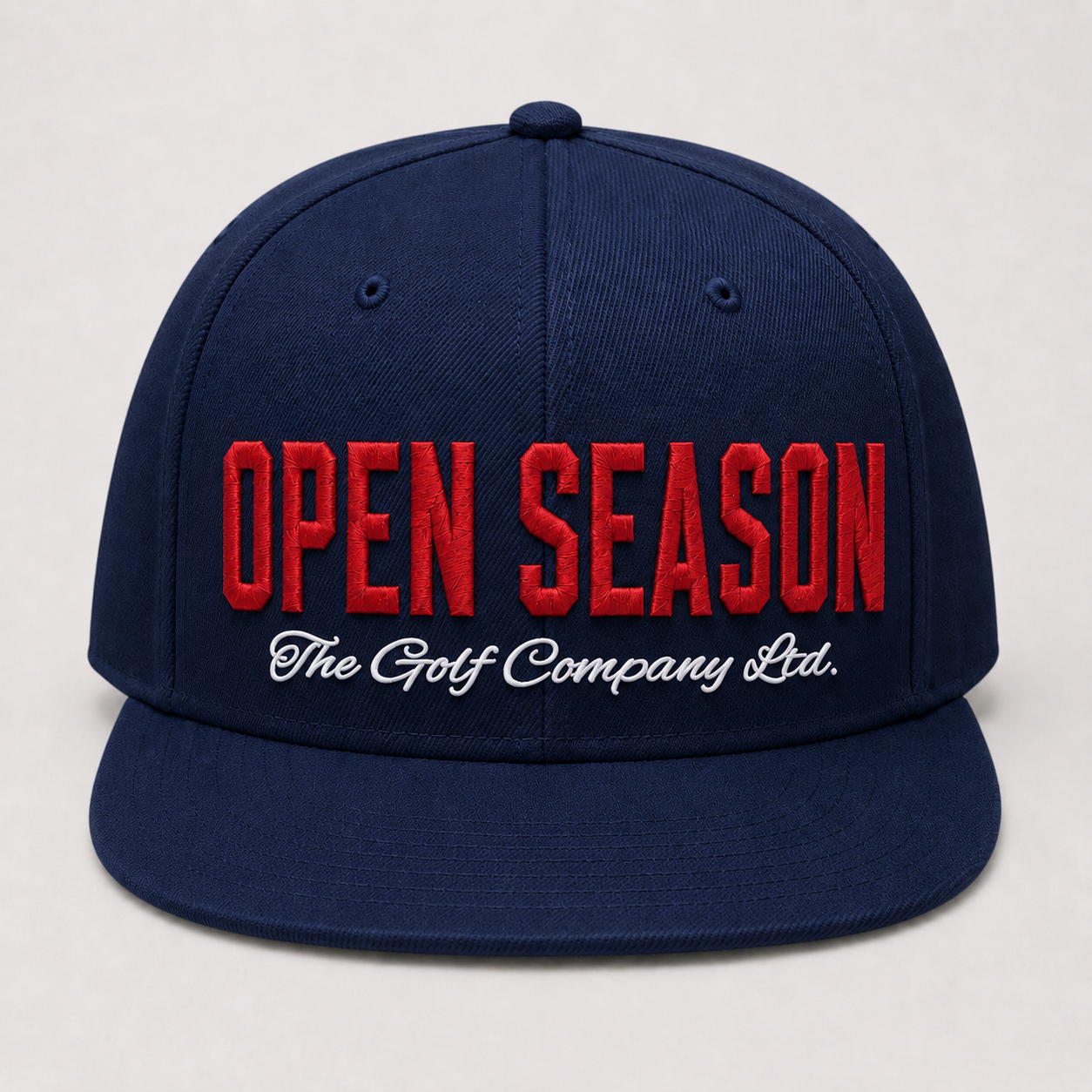 Navy blue cap with red and white text on a light gray background