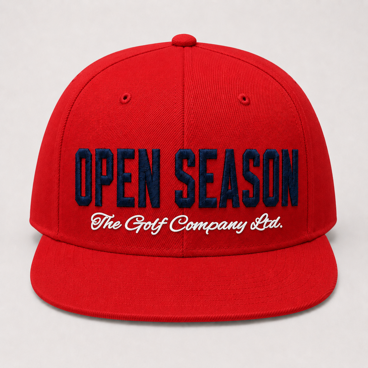 Red cap with 'Open Season' and 'The Golf Company Ltd.' text on a light gray background