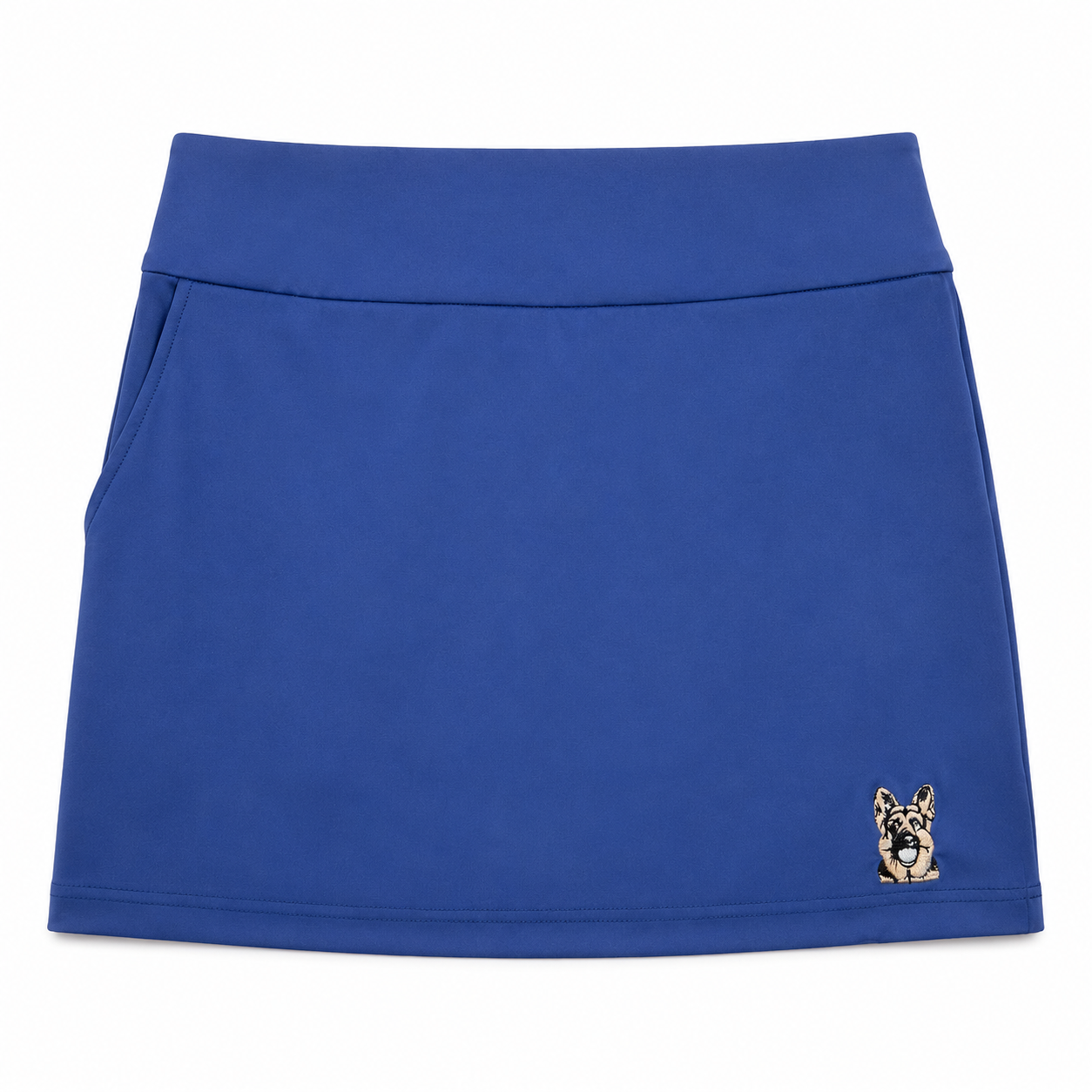 Women’s royal blue performance golf skort front view with embroidered dog logo by The Golf Company Ltd.