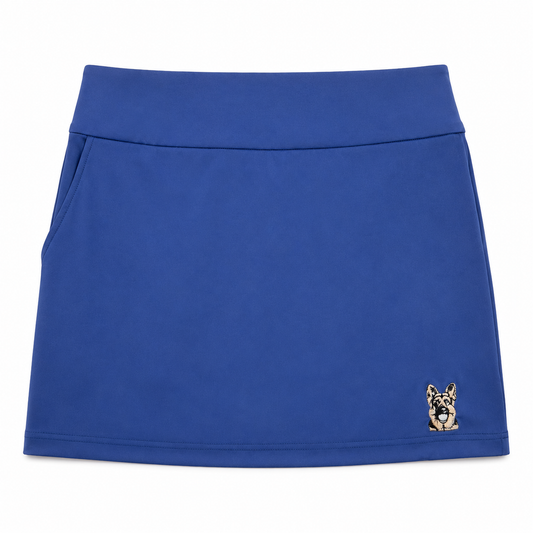 Women’s royal blue performance golf skort front view with embroidered dog logo by The Golf Company Ltd.