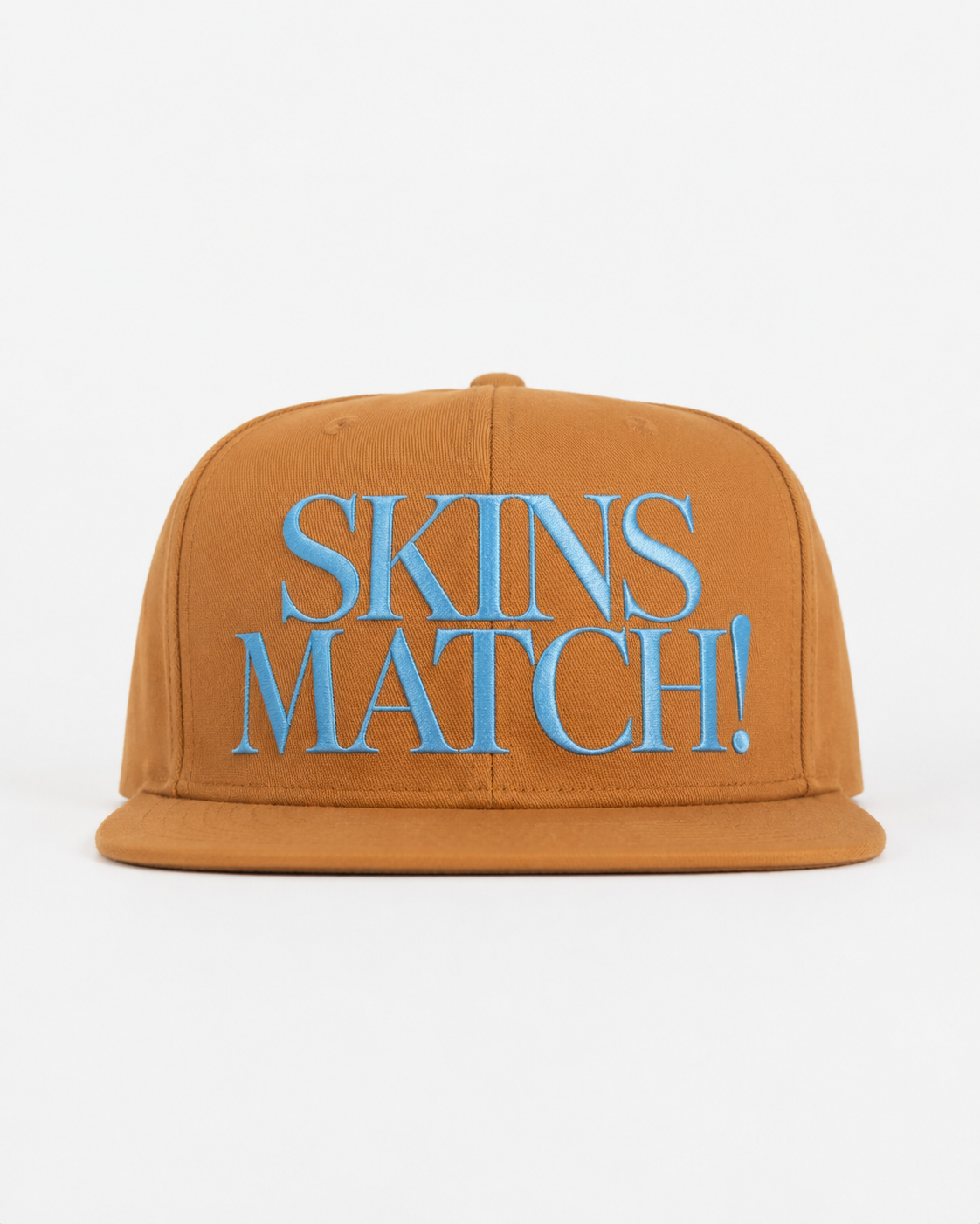 Camel cotton twill snapback cap with sky blue embroidered “SKINS MATCH!” front design