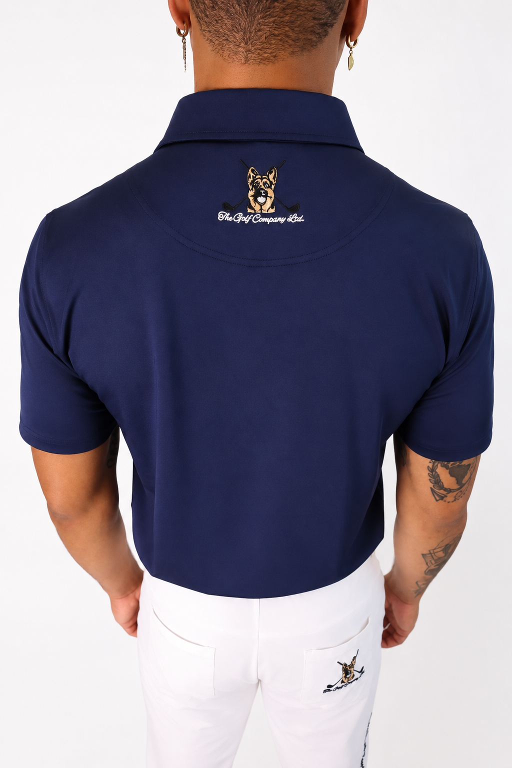 Back view of navy Men’s Signature Performance Golf Shirt with Hudson neck logo detail.