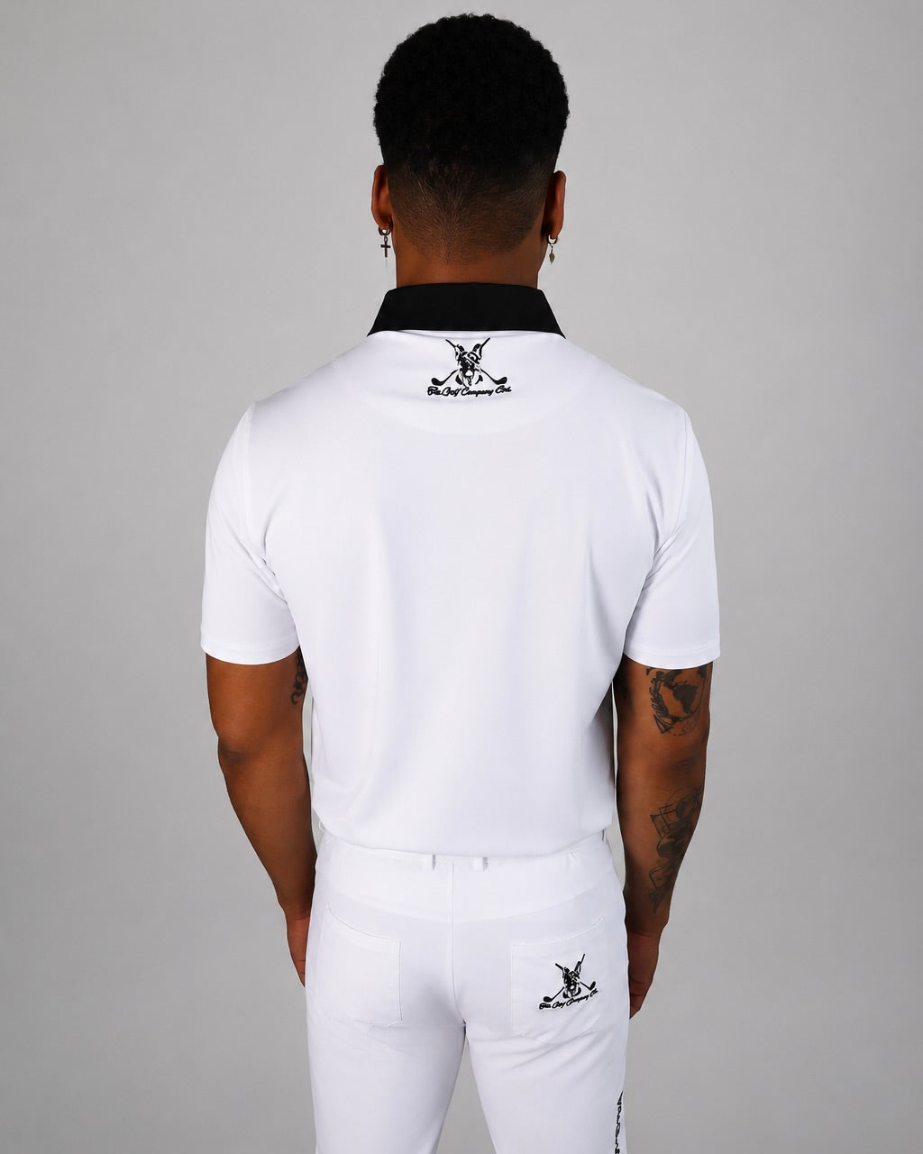Back view of white Men’s Signature Performance Golf Shirt with Hudson neck logo detail.