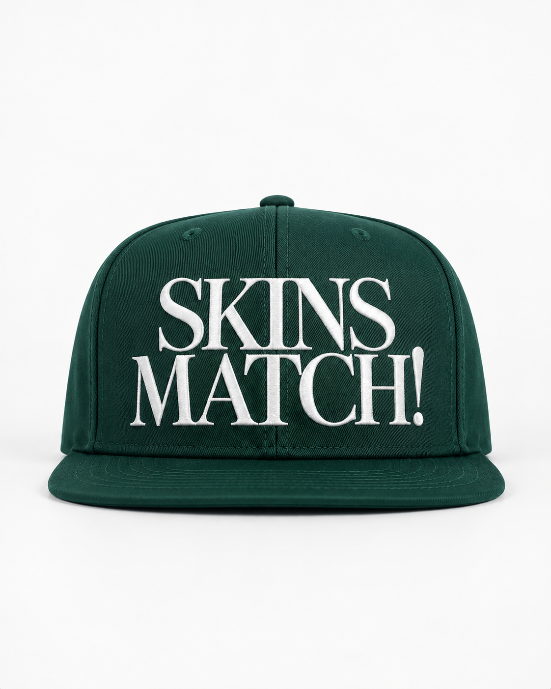 A dark green flat-brim snapback cap featuring the phrase 'SKINS MATCH!' in large white serif lettering across the front panel, set against a plain white background.