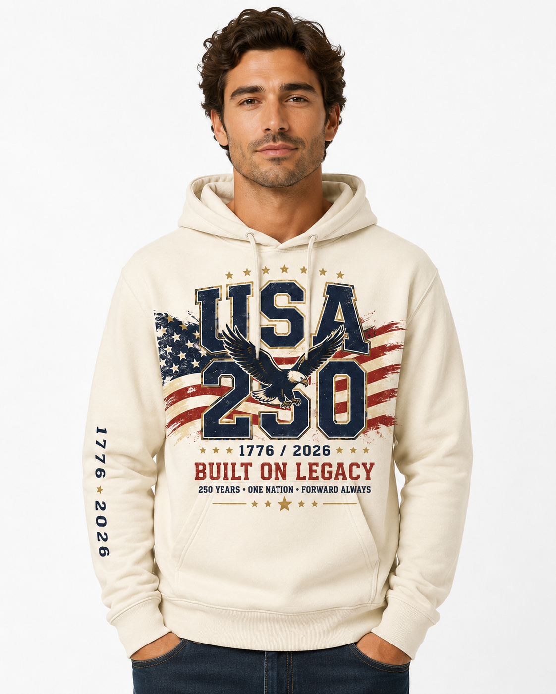 Male model wearing a vintage cream USA 250 fleece hoodie with a large patriotic eagle, American flag, 1776–2026, and “Built On Legacy” front graphic.