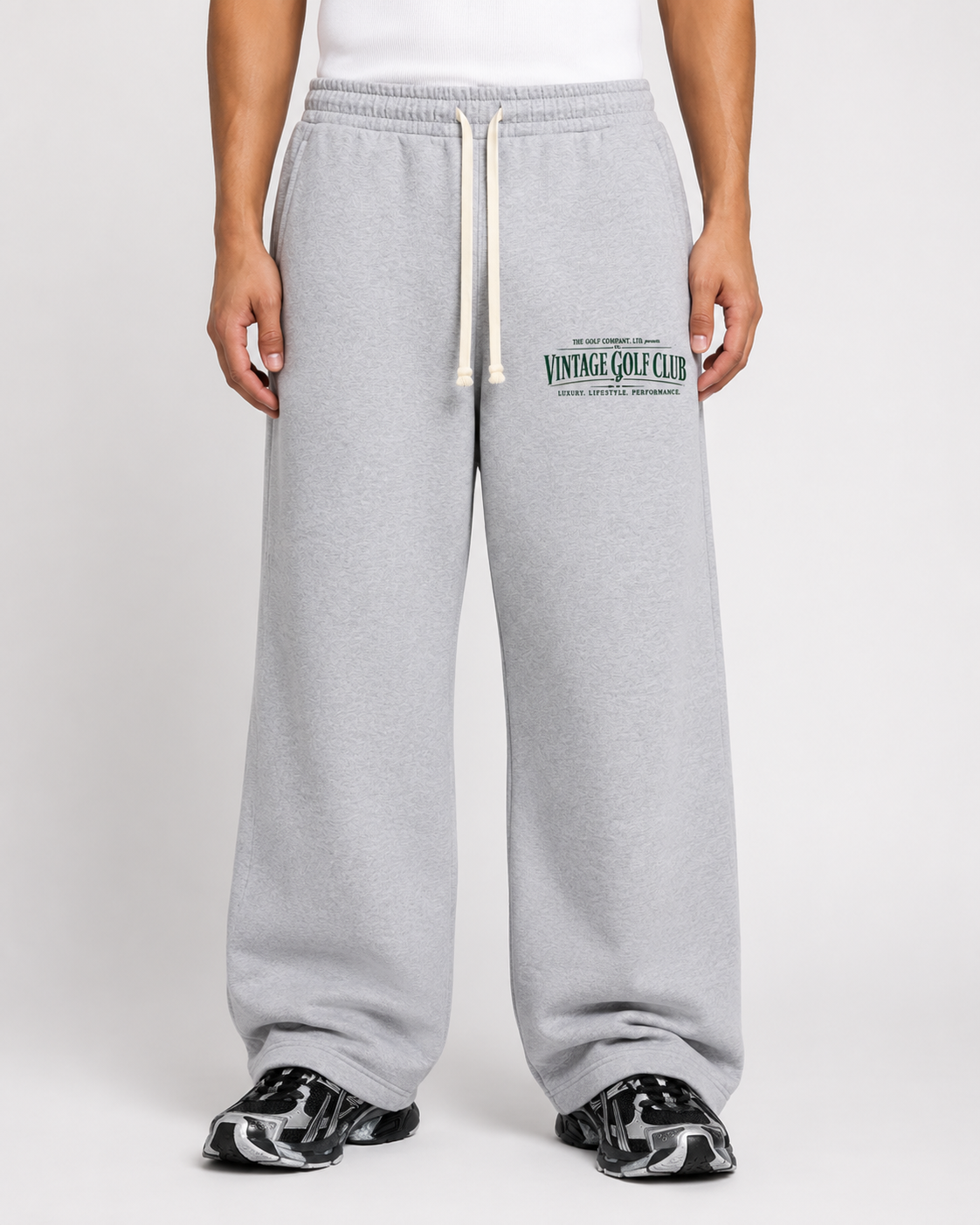 Heather grey Vintage Golf Club weathered sweatpants on male model with cream drawstrings and black sneakers.