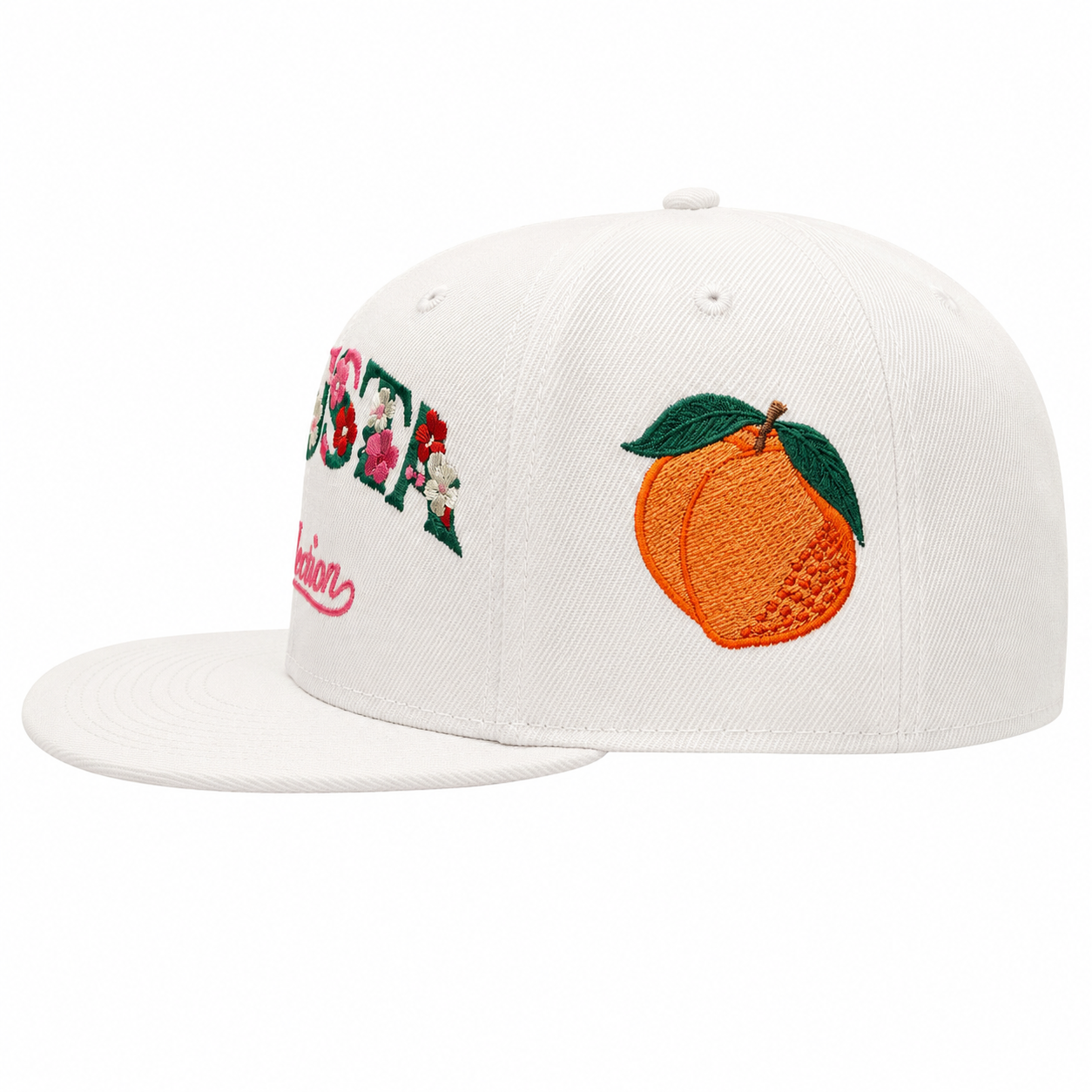 White cap with peach and floral design on a white background