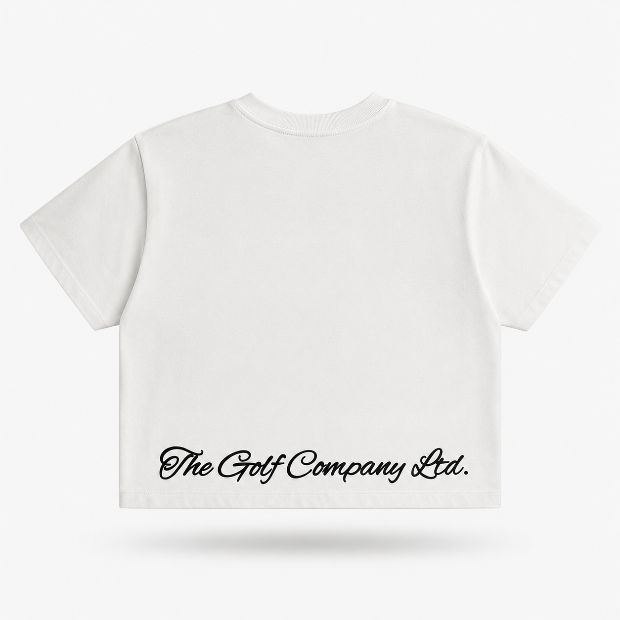 Women’s white heavyweight cropped boxy t-shirt rear view with The Golf Company Ltd script logo.