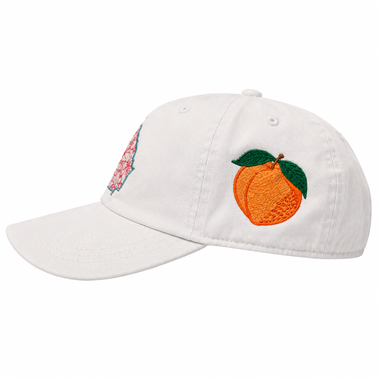 White cap with peach and floral embroidery on a white background