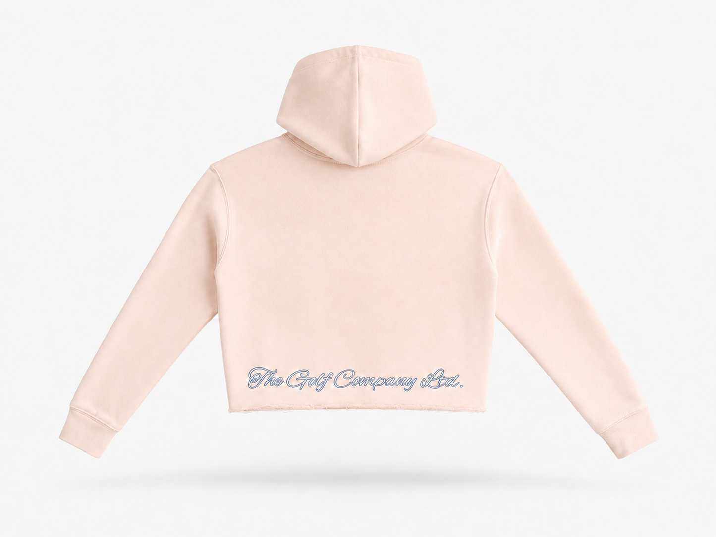 Women’s soft blush crop hoodie rear view with The Golf Company Ltd script logo.