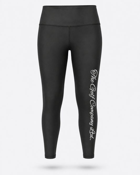 Women’s black yoga leggings front view with The Golf Company Ltd script logo on the leg.