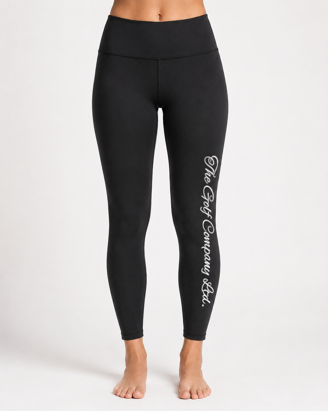 Women’s black yoga leggings front view with The Golf Company Ltd script logo on the leg.