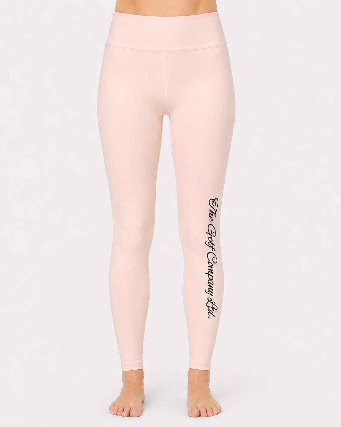 Women’s soft blush yoga leggings front view with The Golf Company Ltd script logo on the leg.