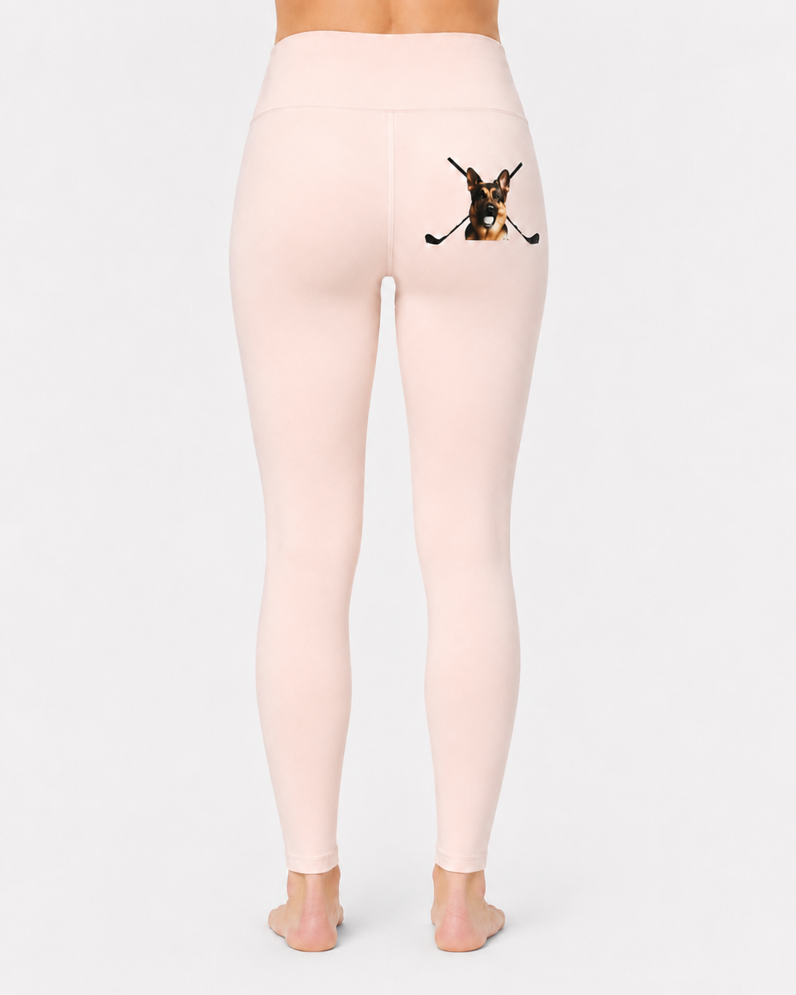 Women’s soft blush yoga leggings rear view with Hudson, the German Shepherd and crossed clubs artwork.