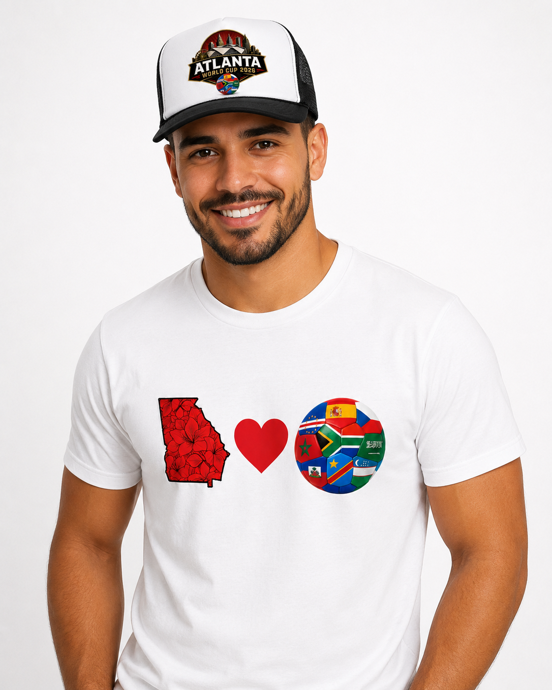 Male model wearing a black Atlanta 2026 skyline trucker cap with matching Georgia soccer tee.