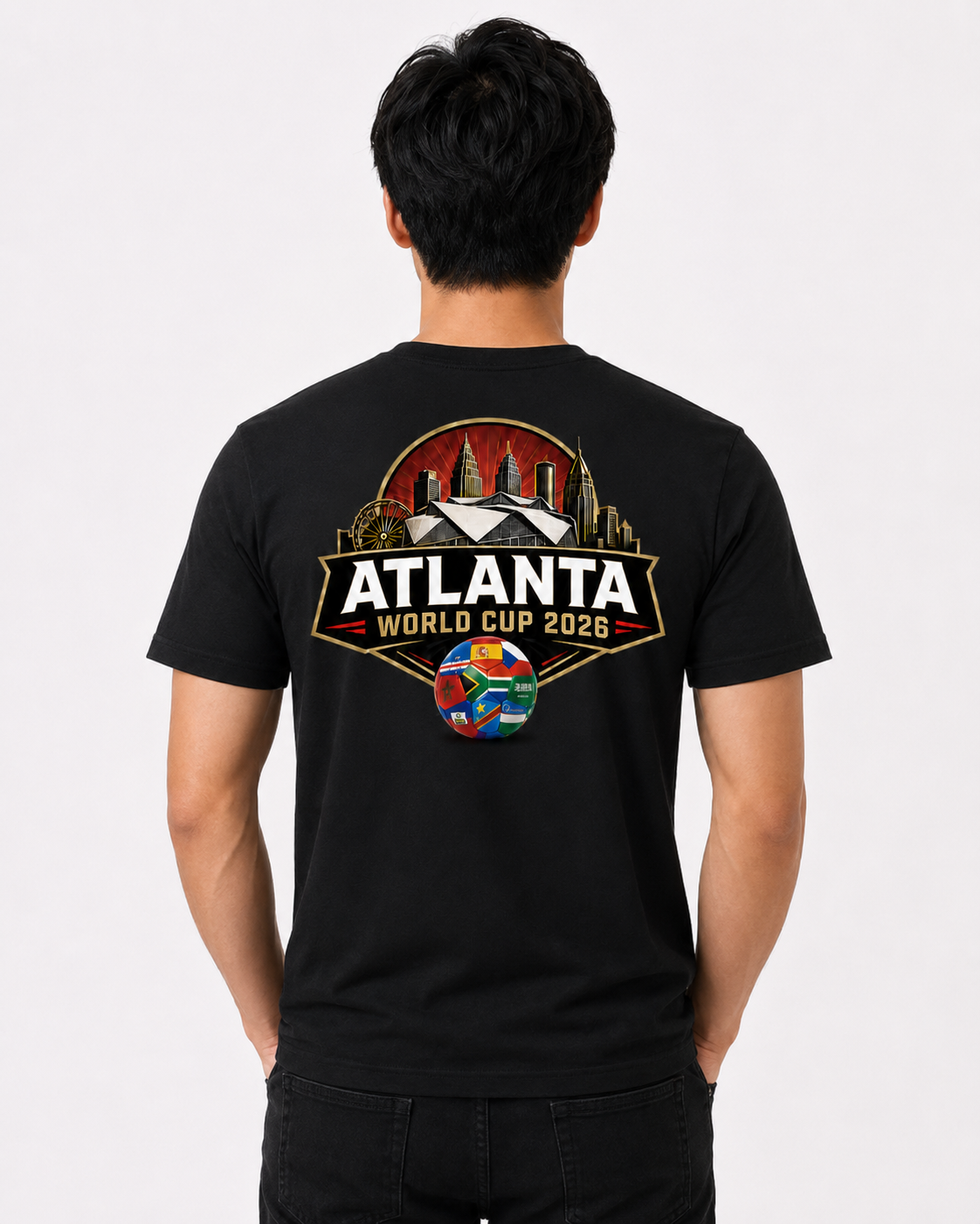 Male model wearing a black Atlanta 2026 Peach Crest tee with large Atlanta skyline and stadium back graphic.