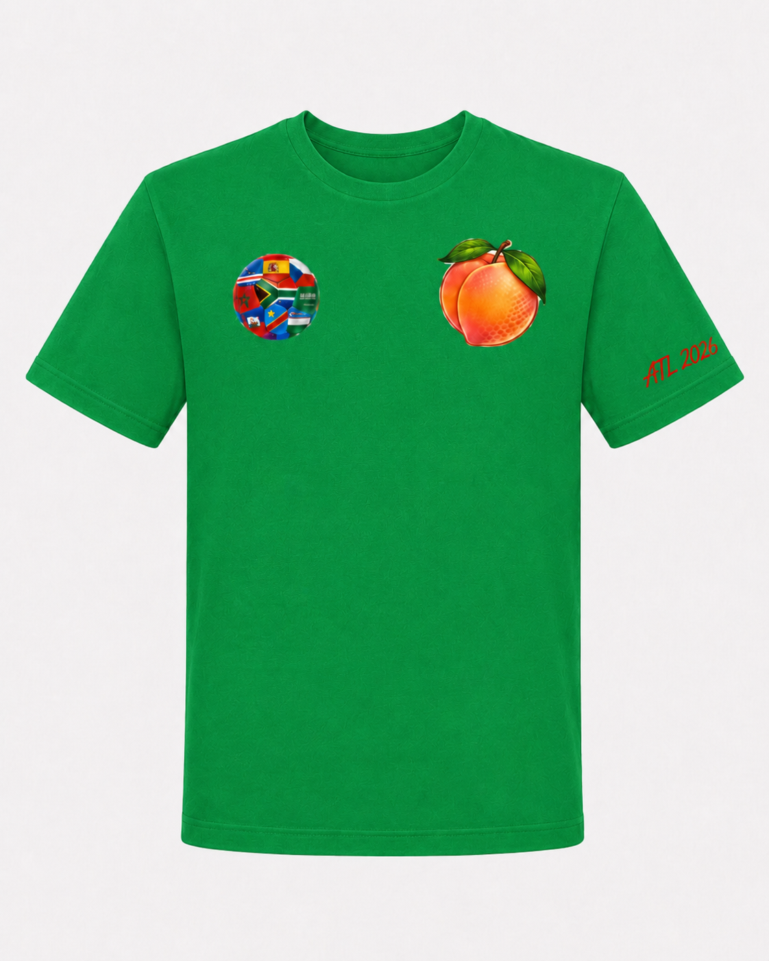 Kelly green Atlanta 2026 tee with multi-nation soccer ball chest graphic, Georgia peach chest graphic, and red ATL 2026 sleeve detail.